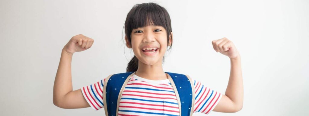 Confident girl showing doing a strong gesture