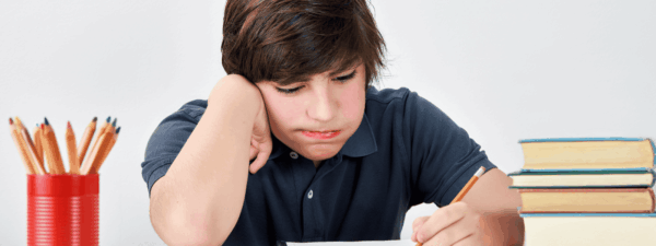 Teenage student frustrated by schoolwork task