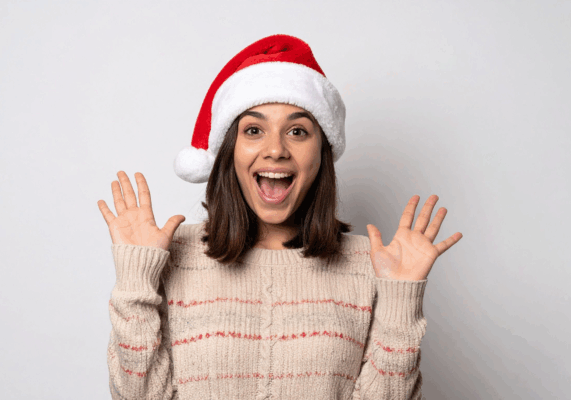 Excited woman wearing Santa hat