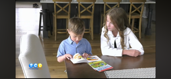 Sully, a LearningRx Savage graduate, reading a book