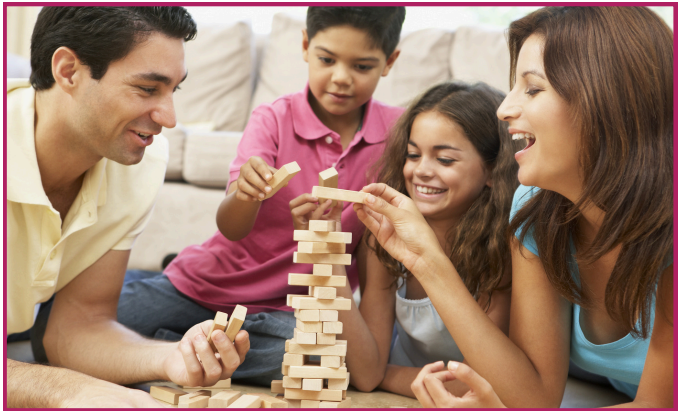 Image of a family playing a game together