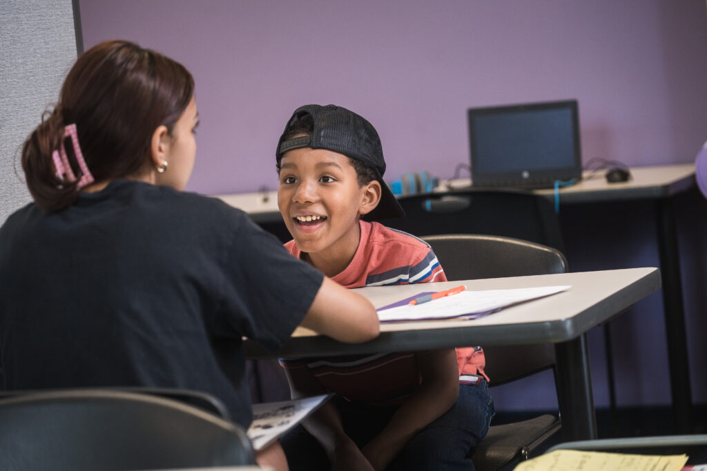 Boy excitedly working with trainer at LearningRx Savage