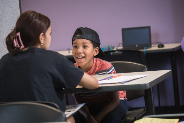 Boy excitedly working with trainer at LearningRx Savage
