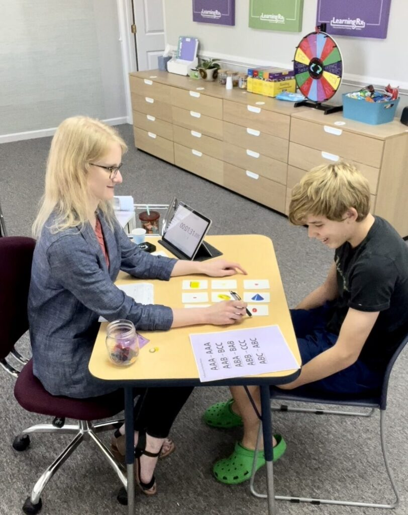Child completing a one-on-one cognitive training exercise with a LearningRx brain trainer.