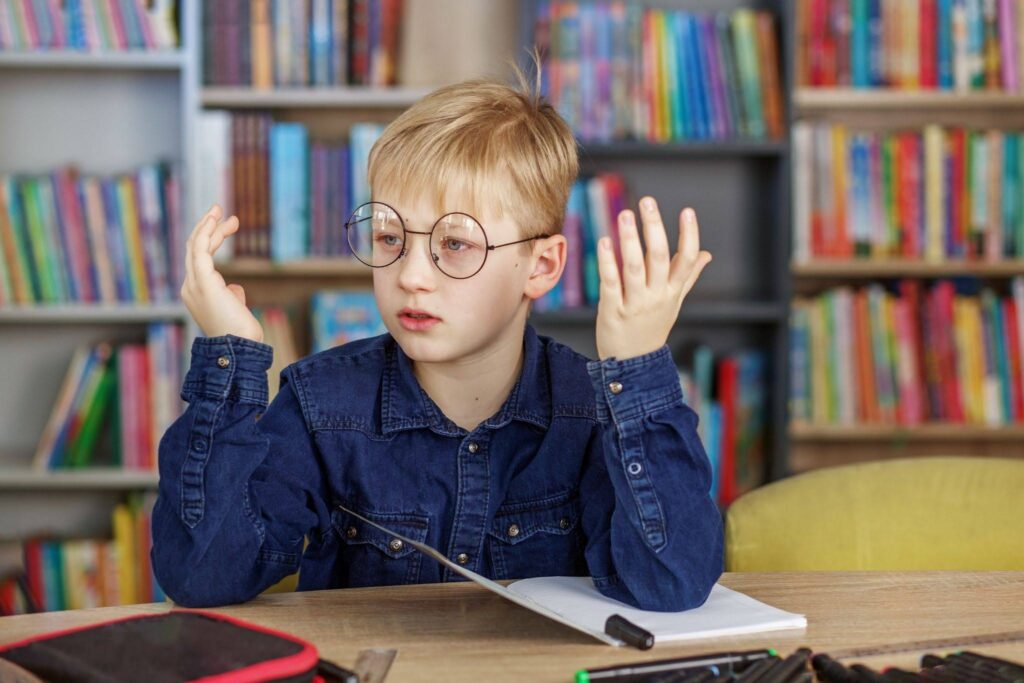 Elementary school student looking frustrated while doing reading homework