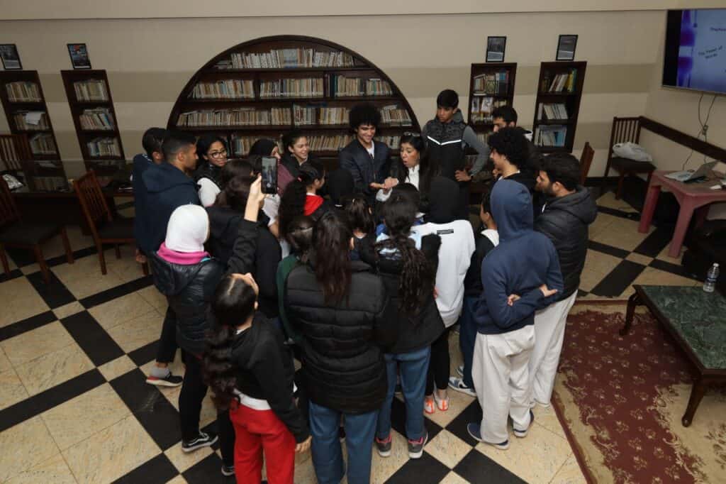 The team gathers around Noha after her talk on the power of mindset.