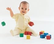 Baby Playing with Colored Cubes