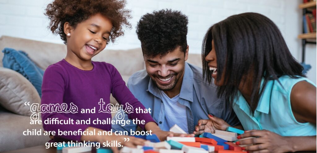A happy family playing with Jenga style blocks. The text states: 
