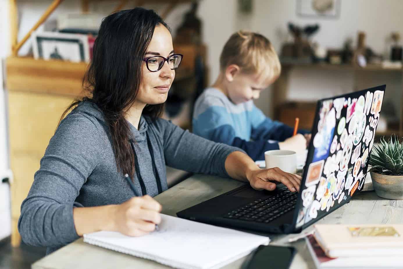 Concept Of Work From Home And Home Family Education. Mom And Son